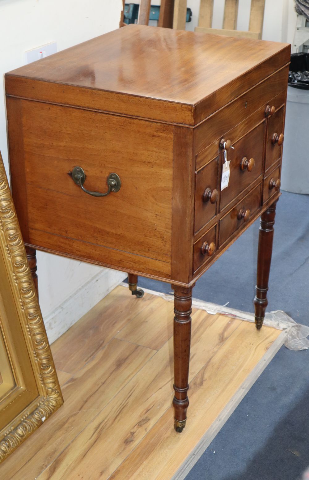 A George III mahogany enclosed washstand with fully fitted interior and pull-out leather lined surface, W.63cm, D.50cm, H.94cm